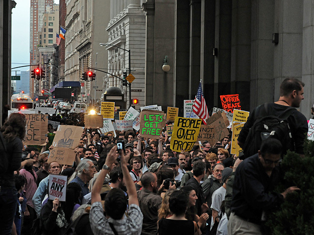Protesters streamed through the arch beneath the Municipal Building. 
