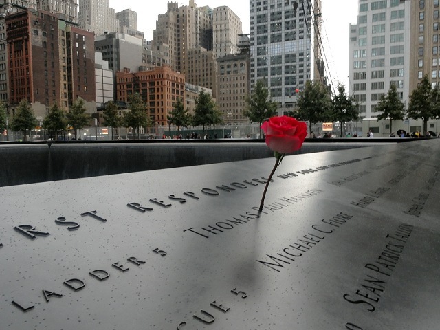 Flowers dot the 9/11 Memorial where loved ones came to remember those lost in the terror attacks. 
