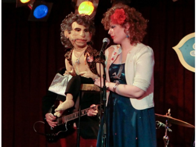 Rhodes on stage with her puppet Mick Jagger during a performance of 