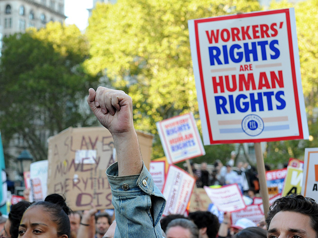 A protester raises his fist in approval of the speaker Oct. 5, 2011. 
