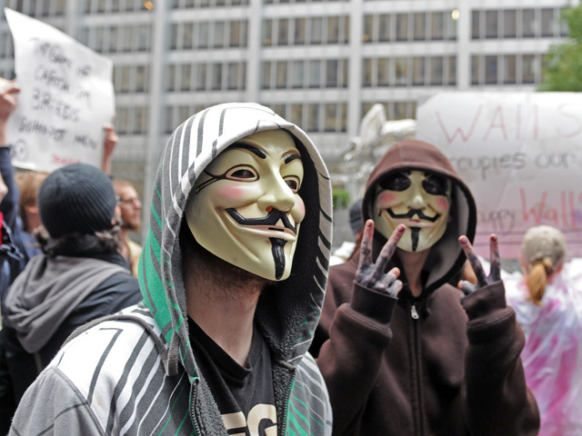 Some protesters wore Guy Fawkes masks. 