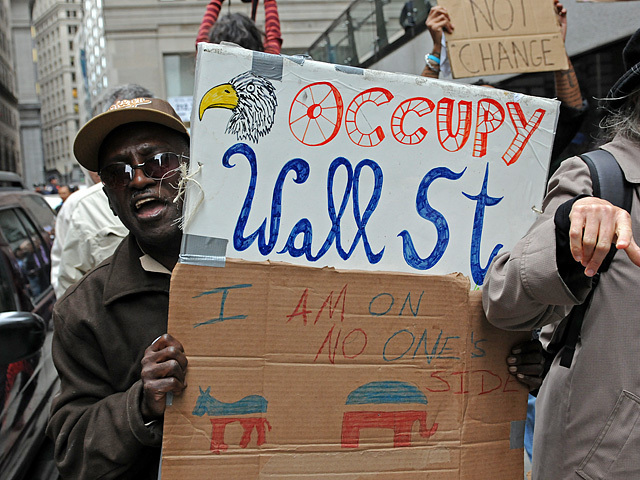 Protesters carried signs and chanted while marching around Chase Bank headquarters. 