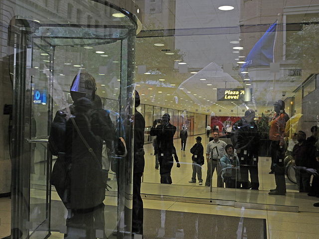 Chase employees watched the protesters at they passed by one of the building's main entrances. 