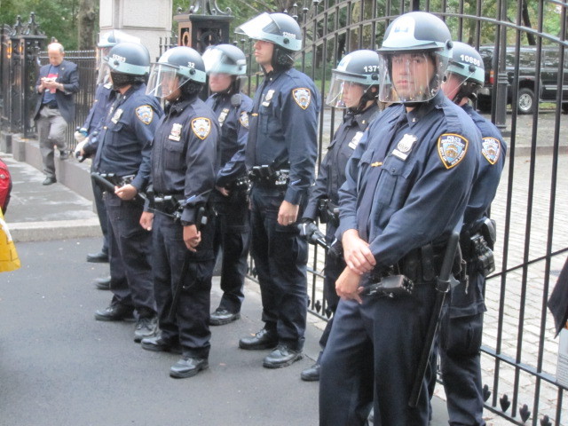 Police stand guard outside City Hall on Broadway during an Occupy Wall Street march on Fri., Oct. 14, 2011. 