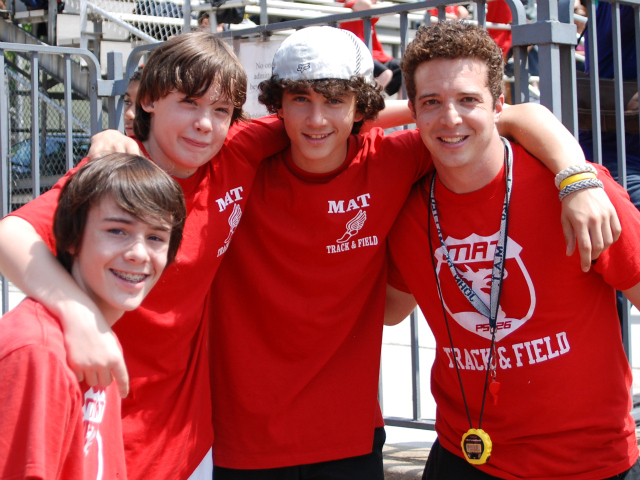 John De Matteo, right, athletic director at the Manhattan Academy of Technology, with some of his students. 