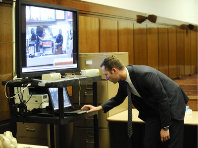 Assistant District Attorney Jamie Mendoza plays the video of the McDonald's altercation for a Manhattan judge on Oct. 18, 2011.