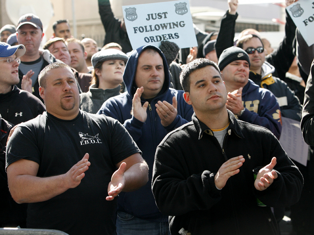 Supporters for the accused NYPD cops involved in ticket fixing scandal outside Bronx Criminal Court Friday morning.