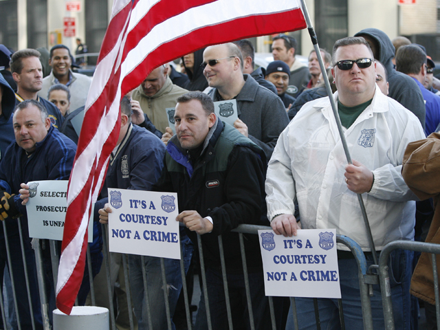 Supporters for the accused NYPD cops involved in ticket fixing scandal outside Bronx Criminal Court Friday morning.
