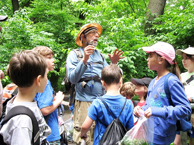 A group of would-be foragers are led through Inwood Hill Park in hunt of delicious treats. 