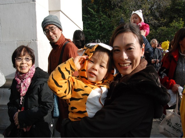 <p>Aya Wada, holds her 2-year-old son, Nozomi, who was dressed as Tigger for the children's Halloween parade.</p>
