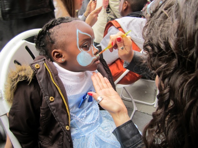 <p>Eniyah Hudgins, 3, got her face painted at the 21st Annual Children's Halloween Parade in the Village.</p>
