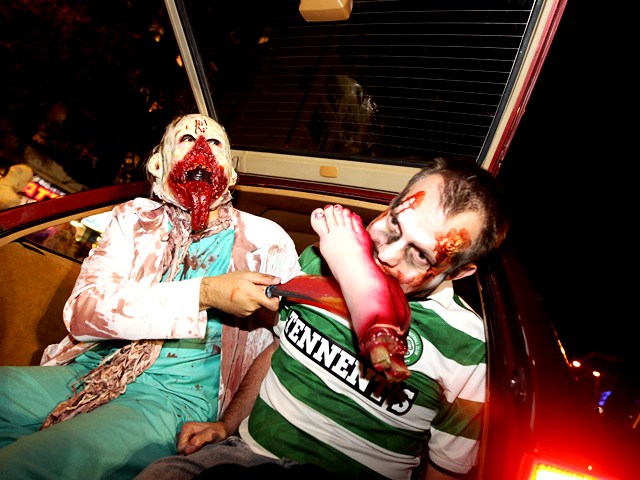 <p>Halloween revelers takes a bite out of this year's parade.</p>
