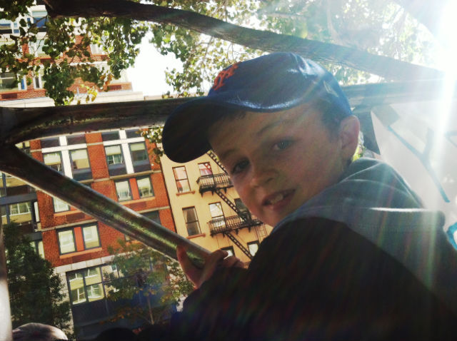 <p>McCauley Carrol, 8, cheers on his firefighter uncle, Trevor Renadette, on the Upper East Side during the New York City Marathon on Nov. 6, 2011.</p>
