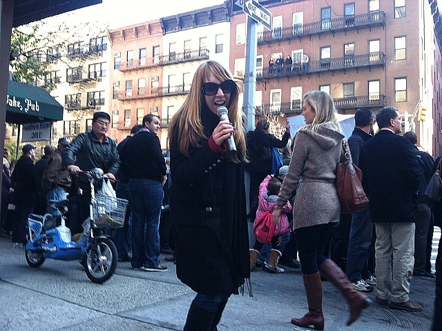 <p>Heather Nolan, 27, the lead singer of the band Waiting for Bobby, performs on 73rd Street and First Avenue for the New York City Marathon on Nov. 6, 2011</p>

