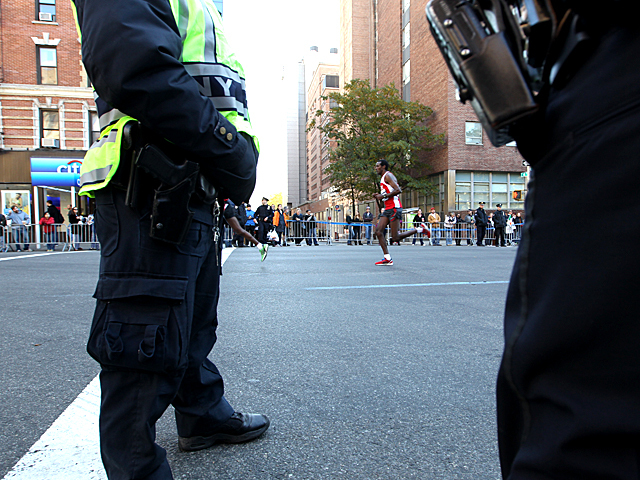 <p>A runner takes part in the NYC Marathon.</p>
