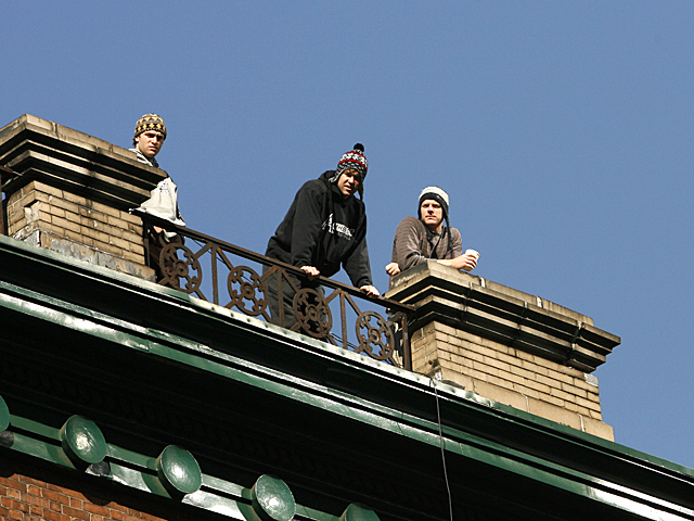 <p>Spectators enjoy the 2011 NYC Marathon from the roof tops of the Upper East Side.</p>
