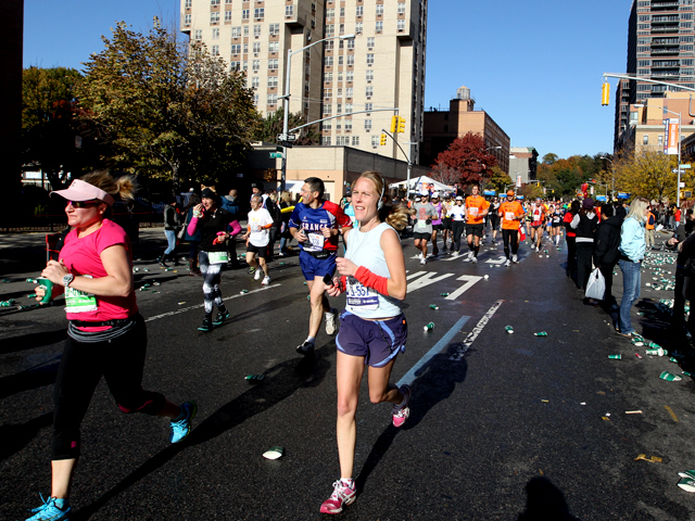 <p>Runners pass through Harlem during the NYC Marathon of 2011.</p>
