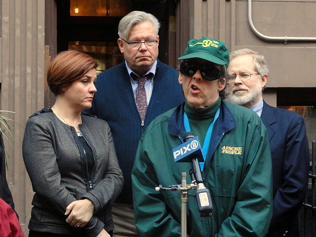 Tenant David Robards faces eviction from his longtime home at 221 W. 16th St. He spoke at a rally on Nov. 6, 2011 with City Council speaker Christine Quinn to his right.