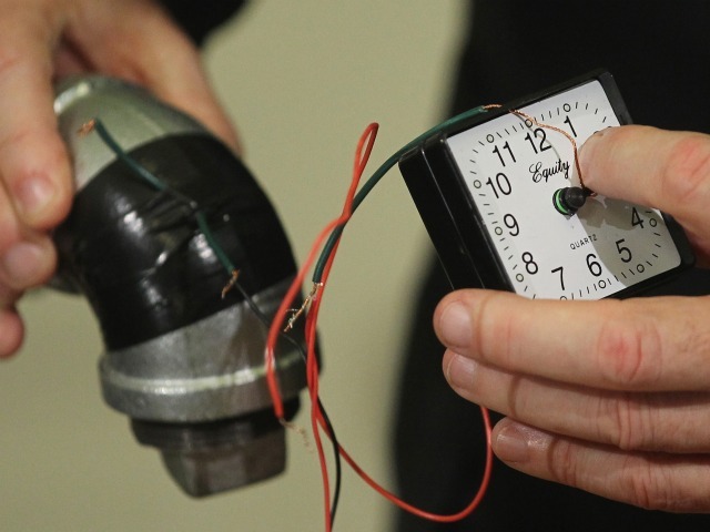 Police Commissioner Ray Kelly holds pieces of a pipe bomb confiscated from alleged 