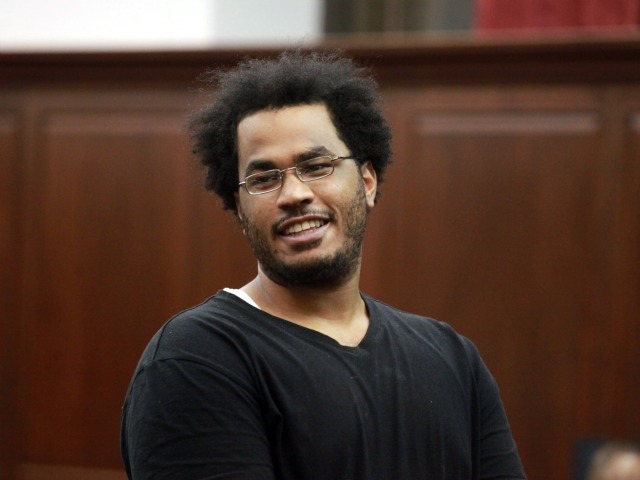 Jose Pimentel cracks a smile during his arraignment in Manhattan Criminal Court Sunday night.