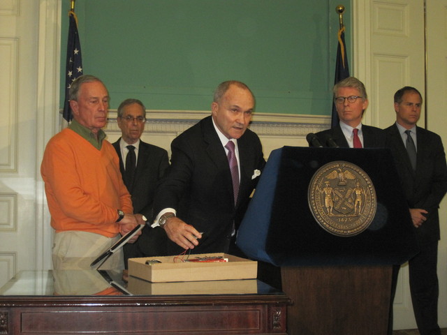 Police Commissioner Ray Kelly shows off a replica of the alleged pipe bombs.