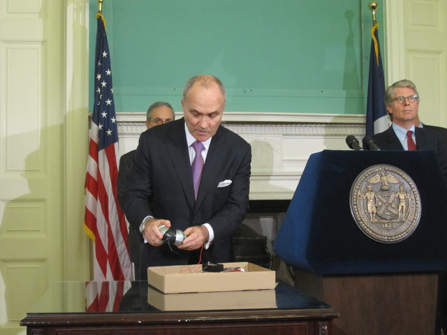 Police Commissioner Ray Kelly shows off a replica of the alleged pipe bombs.