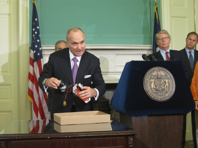 Police Commissioner Ray Kelly shows off a replica of the alleged pipe bombs.