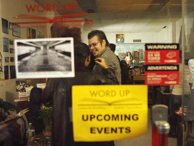 <p>Local residents enjoy a gathering of artists at Word Up.</p>
