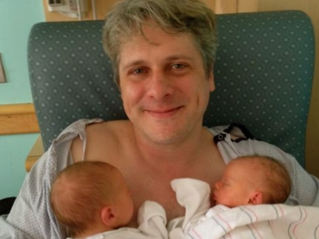 Father Jay Snyder with his twins Reverie Vivian and Jackson.