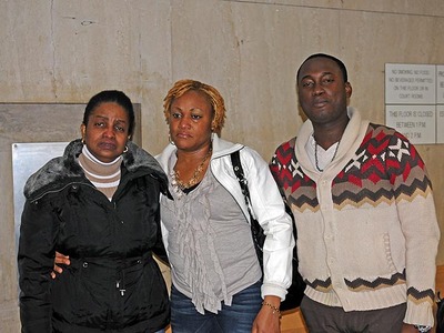 Rayon McIntosh's mother, Maureen Lucas, girlfriend, Althea Bartley and brother-in-law Delmor Wilson, weep tears of joy on Dec. 2, 2011, outside the Manhattan courtroom where Rayon McIntosh was cleared of charges in the McDonald's beating case.