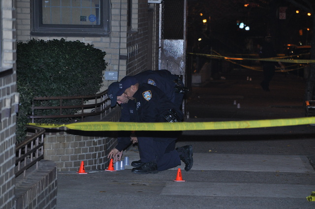 Police investigate a shooting outside 120 W. 94th St. late Sun., Dec. 4, 2011.