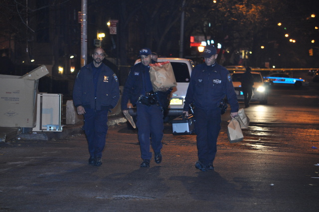 Police investigate a shooting outside 120 W. 94th St. late Sun., Dec. 4, 2011.