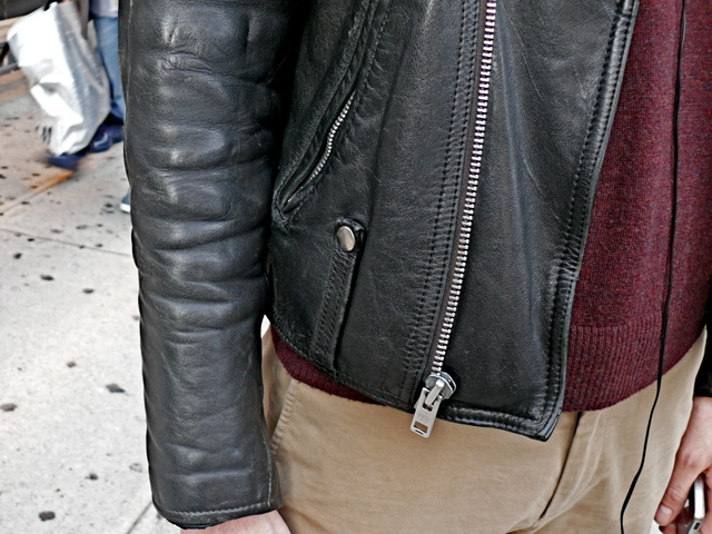 Belt loop and zipper details on the well burnished jacket, worn by Andrew H., Soho.