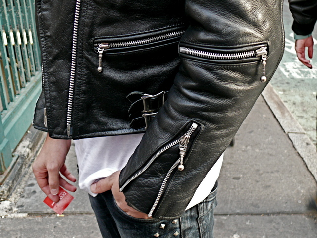 Zipper details of Daniel B.'s trim fitting biker with studded jeans, on Prince Street, SoHo.
