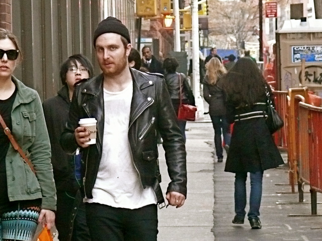 A wide neck t-shirt, knitted hat and fitted biker jacket in Washington Square East.