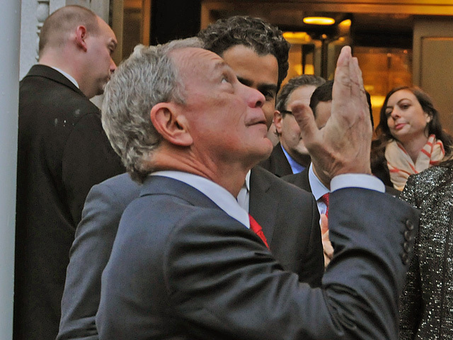 Water drips on Mayor Bloomberg as he stands under a new scaffolding design called the 