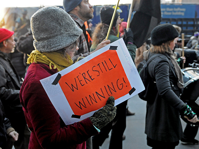 An Occupy Wall Street protester uses some humor to get her point across, Dec. 12, 2011. 