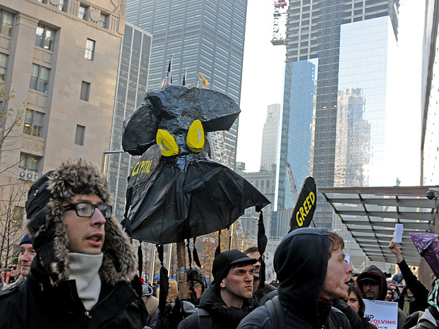 Protesters made giant squid puppets, calling Goldman Sachs a 