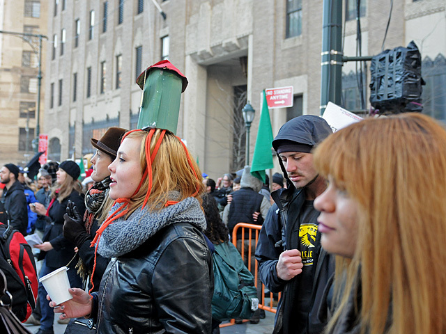 An Occupy Wall Street protester wears a squid hat outside the global headquarters for Goldman Sachs, Dec. 12, 2011. 