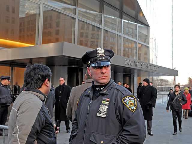 Police guard the entrance to Goldman Sachs' headquarters from protesters at 200 West Street, Dec. 12, 2011. 