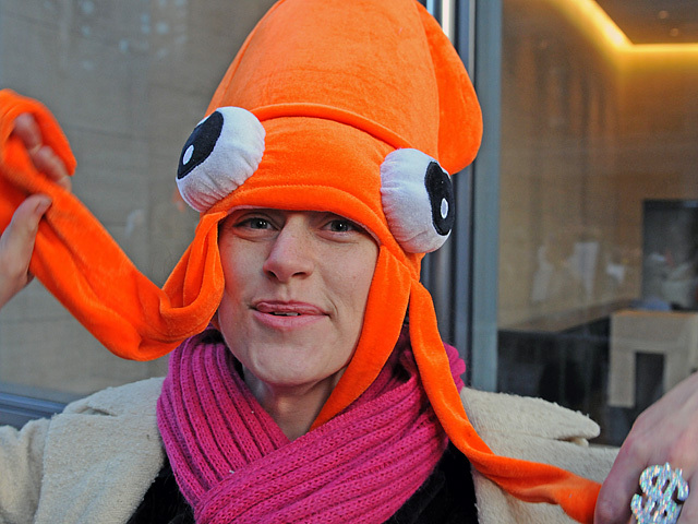 A protesters wears here squid hat while marching around Goldman Sachs' headquarters, Dec. 12, 2011. 