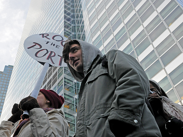 Protesters march around 200 West Street, where Goldman Sachs has their headquarters, Dec. 12, 2011. 