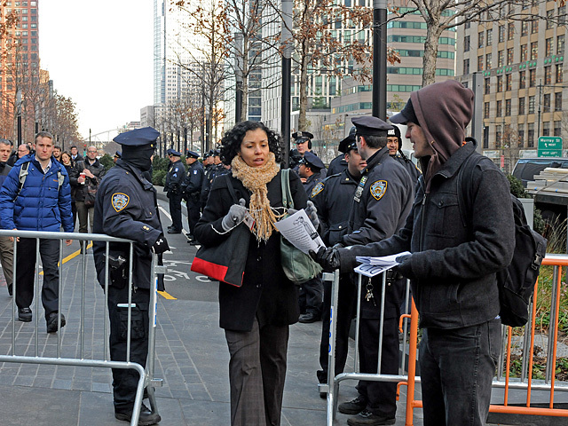 Protesters handed out flyers to commuters passing by 200 West Street, Dec. 12, 2011. 