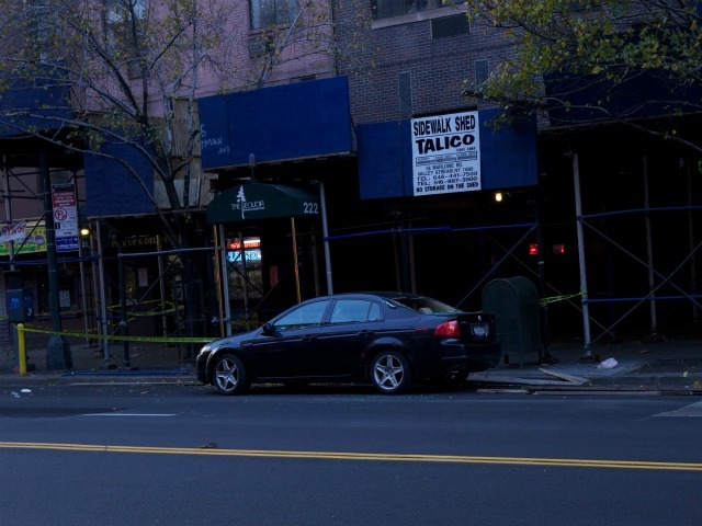 A car parked near the scaffolding was damaged by the debris.