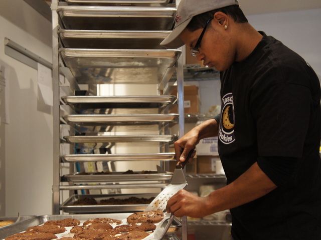 Manager Rafi Safadit prepares cookies for sale at the newly-opened Insomnia Cookies on the Upper East Side.