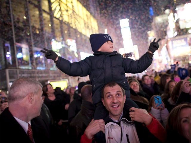 Luis Tito, 6, celebrates atop the shoulders of his father, Jorge Tito, in Times Square just after the annual ball drop January 01, 2011 in New York City. This year a 11,875-pound Waterford crystal ball descended a 141-foot tall flagpole to mark the beginning of 2011. 