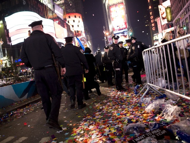 New York Police Department officers walk through Times Square after the annual ball drop January 01, 2011 in New York City. This year a 11,875-pound Waterford crystal ball descended a 141-foot tall flagpole to mark the beginning of 2011. 