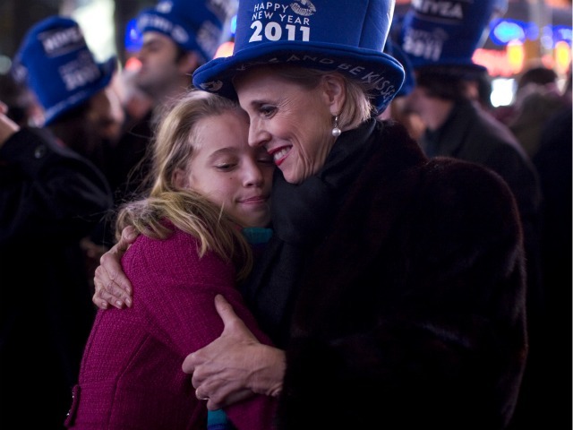 Laura Geiger (R) hugs her daughter Livia Lanier Geiger, 10, both of Barnesville, Georgia in Times Square just after the annual ball drop January 01, 2011 in New York City. This year a 11,875-pound Waterford crystal ball descended a 141-foot tall flagpole to mark the beginning of 2011. 