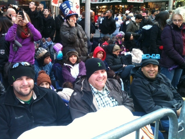 People gather at 46th St. and Seventh Ave.