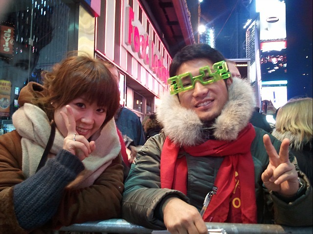 Takahiro Tomiyasu, 27, a sailor from Fukuoka, Japan and his girlfriend Shirai Kanna, 30 ring in the New Year in Times Square on Dec. 31, 2011.